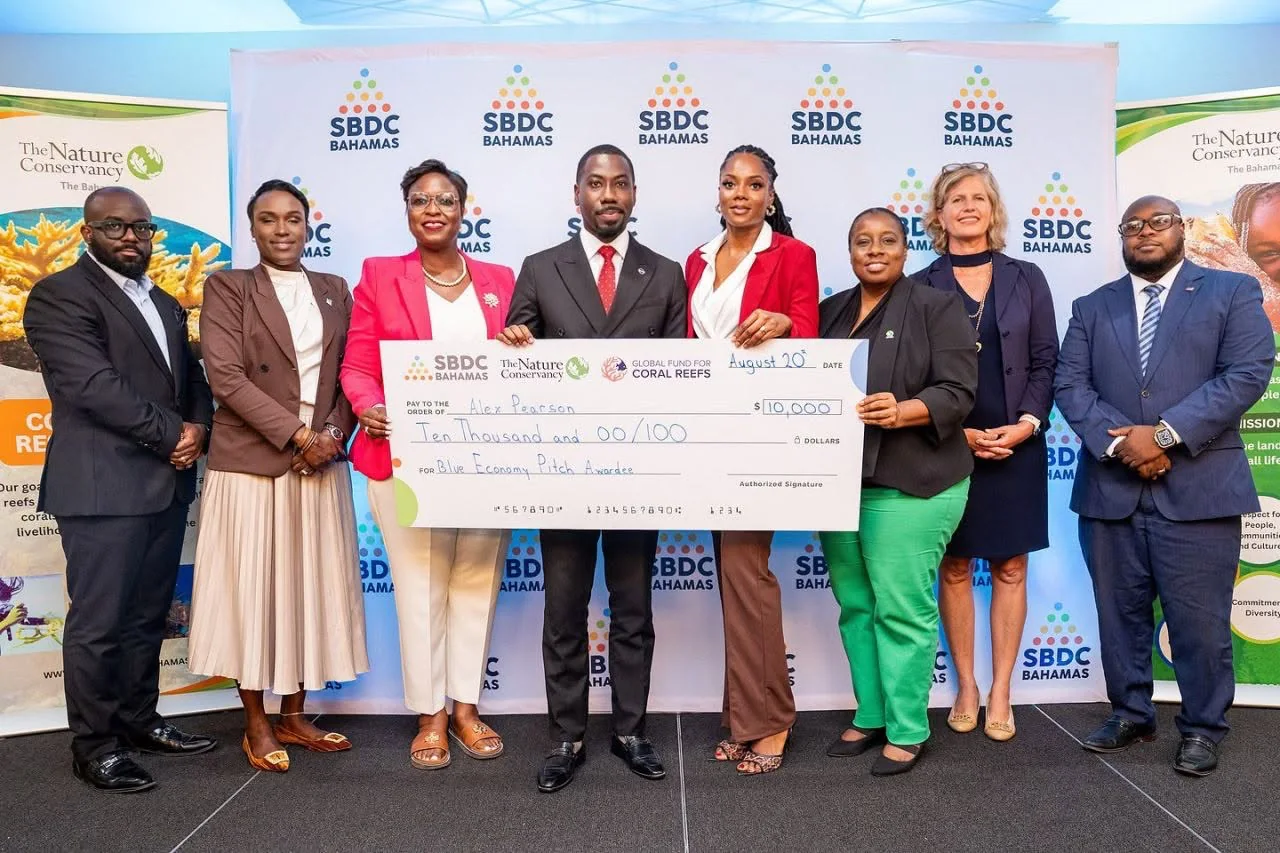 Alex Pearson with the SBDC Bahamas Blue Economy Accelerator grant award